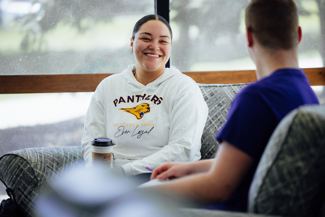 Two students chatting while having coffee
